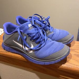 Purple and grey Women’s Nike Frees.